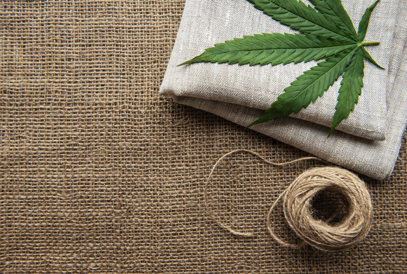 cannabis-leaves-on-the-hemp-textile-background-2021-12-15-23-44-06-utc Large.png